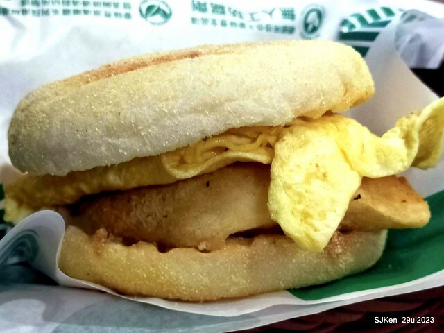 Muffin burger with fish steak and fried egg and Ceylon black tea at Taiwan fastfood store 