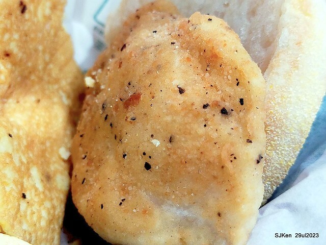 Muffin burger with fish steak and fried egg and Ceylon black tea at Taiwan fastfood store 