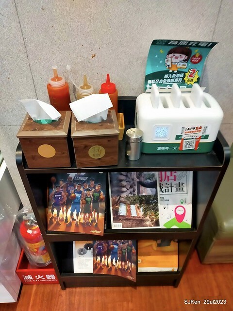 Muffin burger with fish steak and fried egg and Ceylon black tea at Taiwan fastfood store 