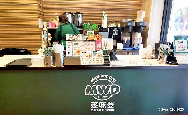 Muffin burger with fish steak and fried egg and Ceylon black tea at Taiwan fastfood store 