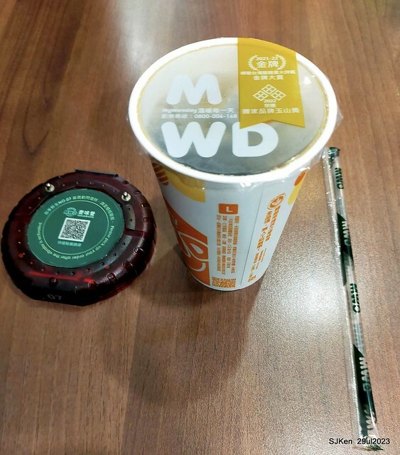 Muffin burger with fish steak and fried egg and Ceylon black tea at Taiwan fastfood store 