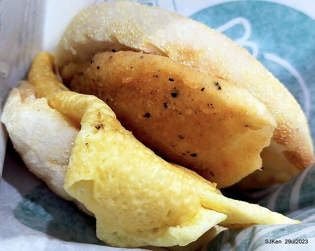 Muffin burger with fish steak and fried egg and Ceylon black tea at Taiwan fastfood store 