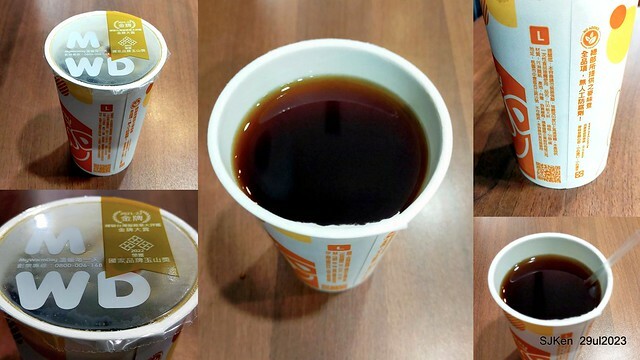 Muffin burger with fish steak and fried egg and Ceylon black tea at Taiwan fastfood store 