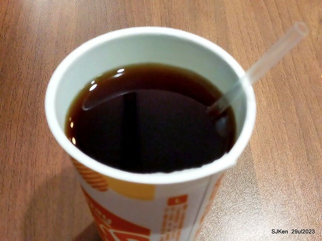 Muffin burger with fish steak and fried egg and Ceylon black tea at Taiwan fastfood store 