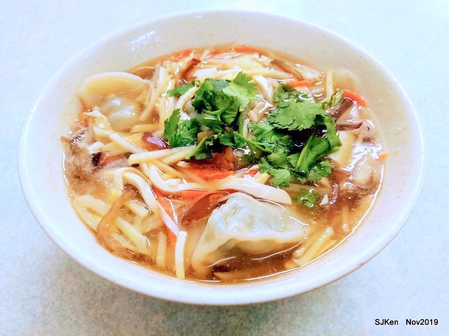 The spicy soup with Chives taste dumpling & seafood fried noodle at the traditional dumpling store ,Taipei, Taiwan, Nov 16, 2019