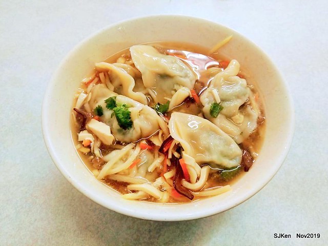 The spicy soup with Chives taste dumpling & seafood fried noodle at the traditional dumpling store ,Taipei, Taiwan, Nov 16, 2019