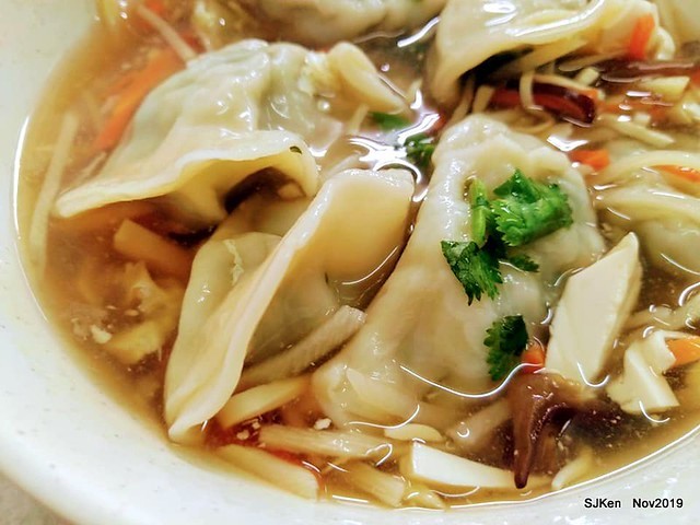 The spicy soup with Chives taste dumpling & seafood fried noodle at the traditional dumpling store ,Taipei, Taiwan, Nov 16, 2019