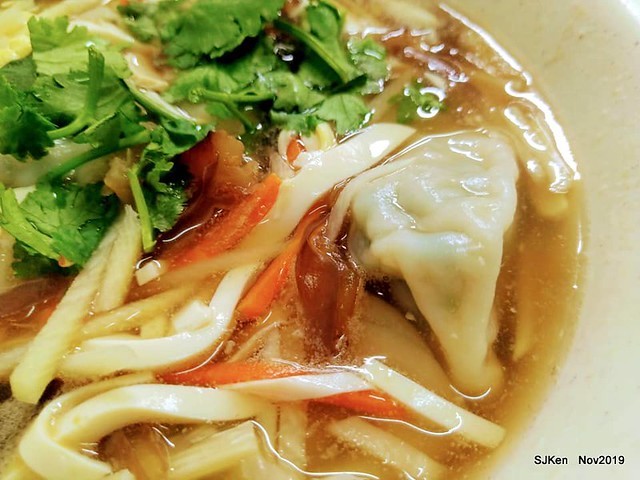 The spicy soup with Chives taste dumpling & seafood fried noodle at the traditional dumpling store ,Taipei, Taiwan, Nov 16, 2019