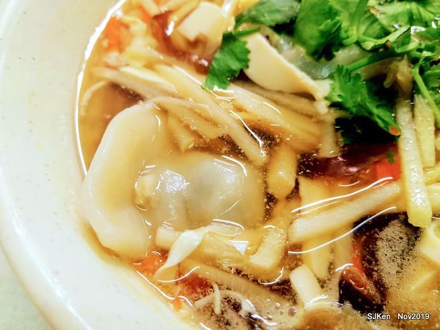 The spicy soup with Chives taste dumpling & seafood fried noodle at the traditional dumpling store ,Taipei, Taiwan, Nov 16, 2019