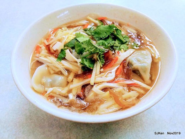 The spicy soup with Chives taste dumpling & seafood fried noodle at the traditional dumpling store ,Taipei, Taiwan, Nov 16, 2019